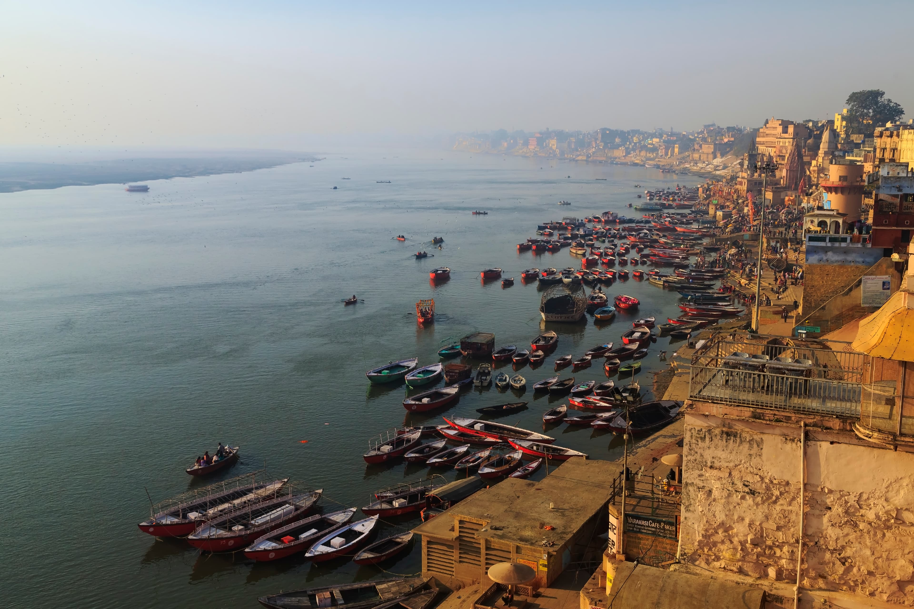 Aerial view of the Varanasi ghats and boats along the Ganges at golden hour
